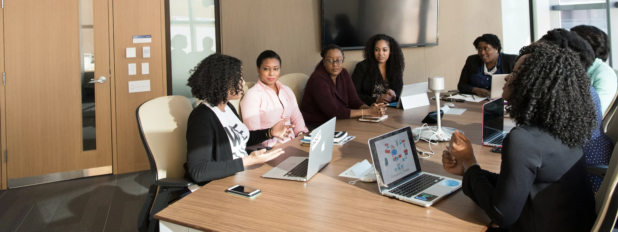 A group sitting around a conference table