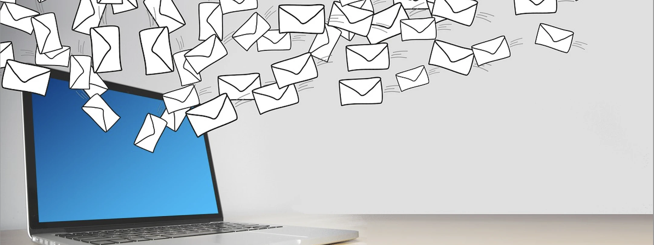 mail flying out of a laptop screen